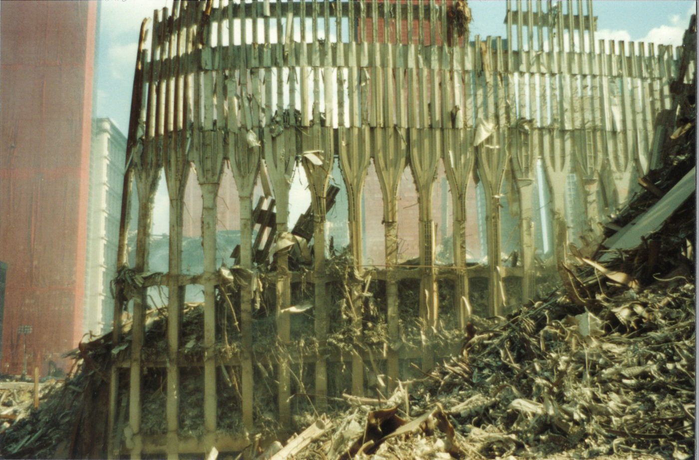 Falling Exoskeleton of WTC at Ground Zero surrounded by Debris