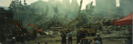 Workers and Fire Fighters Looking at Work in the Evening at Ground Zero