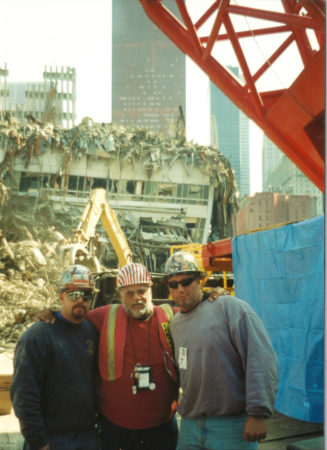 Workers in front of destroyed Marriot Hotel