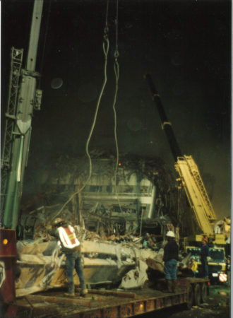 Workers loading a flatbed with debris at Ground Zero