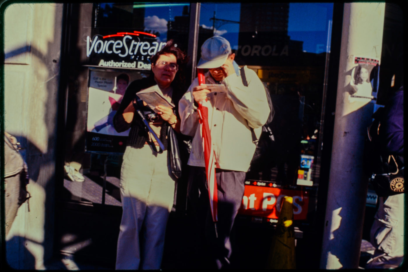 Pedestrians Stop Outside Store Near Chambers and Hudson Streets, Missing Person Flyer on Pole Beside Door.jpg