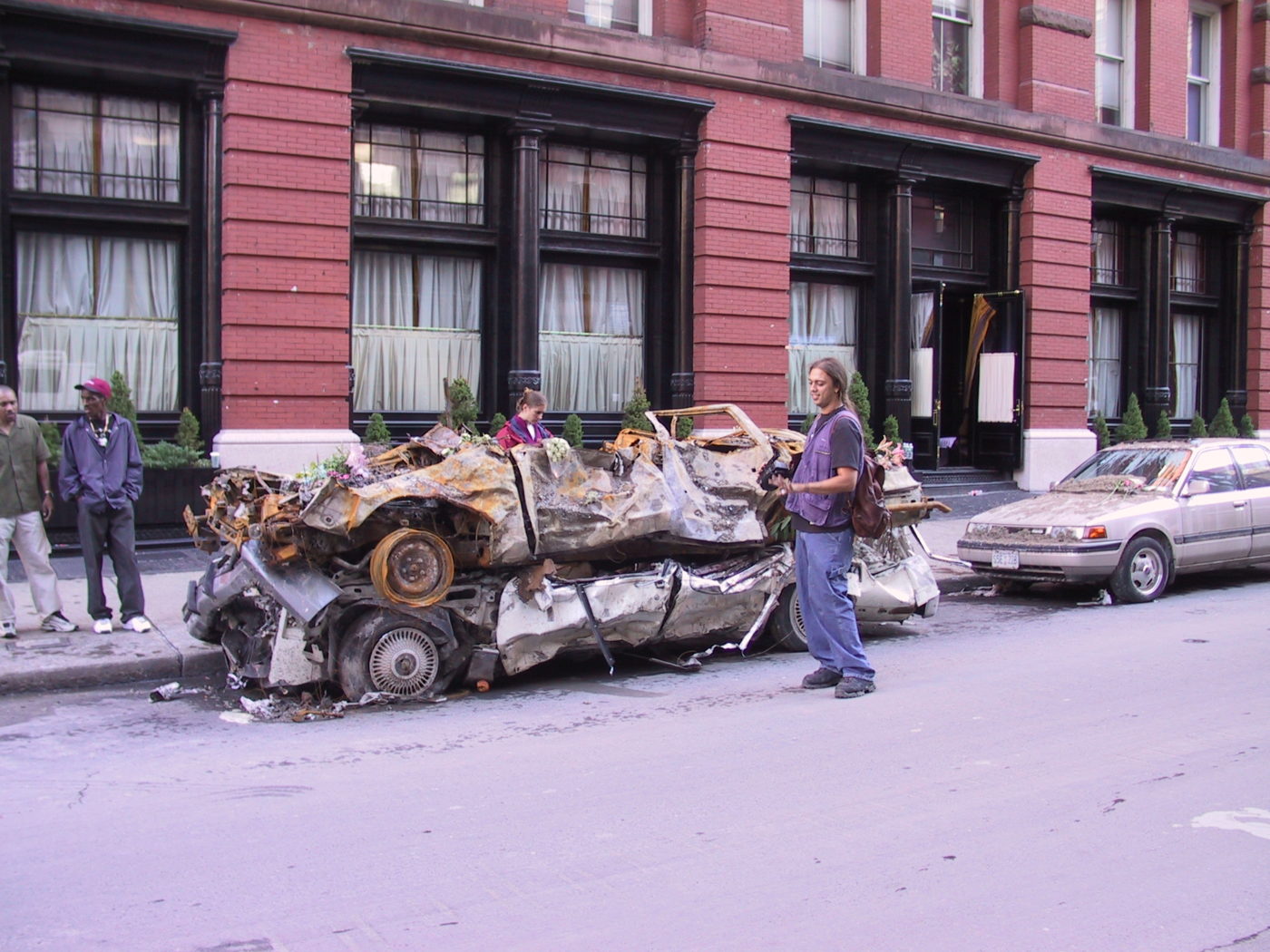 Crushed Cars Piled on top of Eachother.JPG