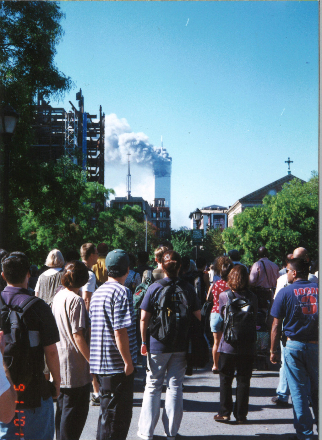 New Yorkers Gather to Watch from Washington Square Park as Tower 1 Burning after Collapse of Tower 2 .jpg