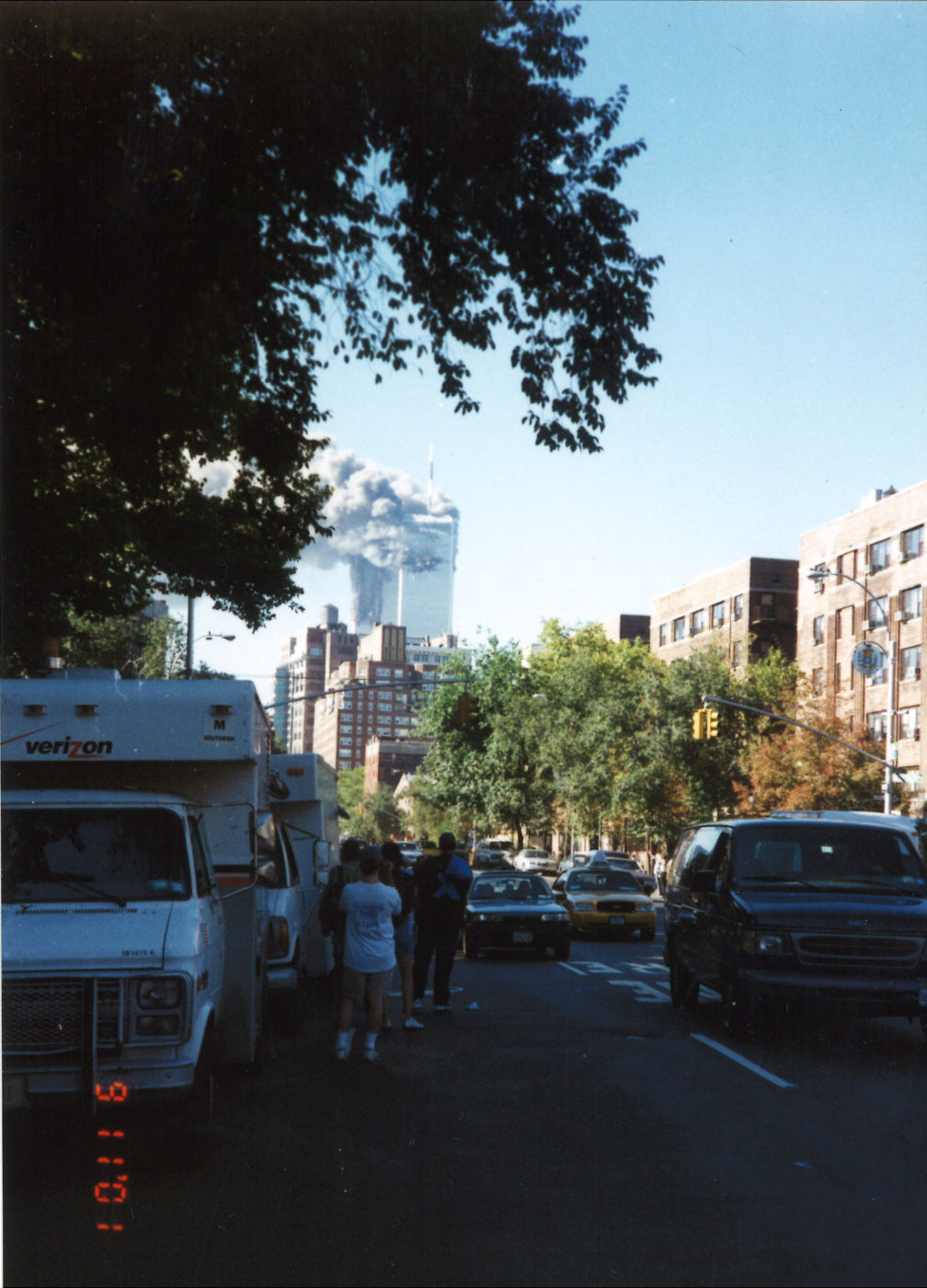 New Yorkers Standing Alongside Wacthing Traffic Towers Burning as seen from Bleecker Street and 6th Avenue.jpg