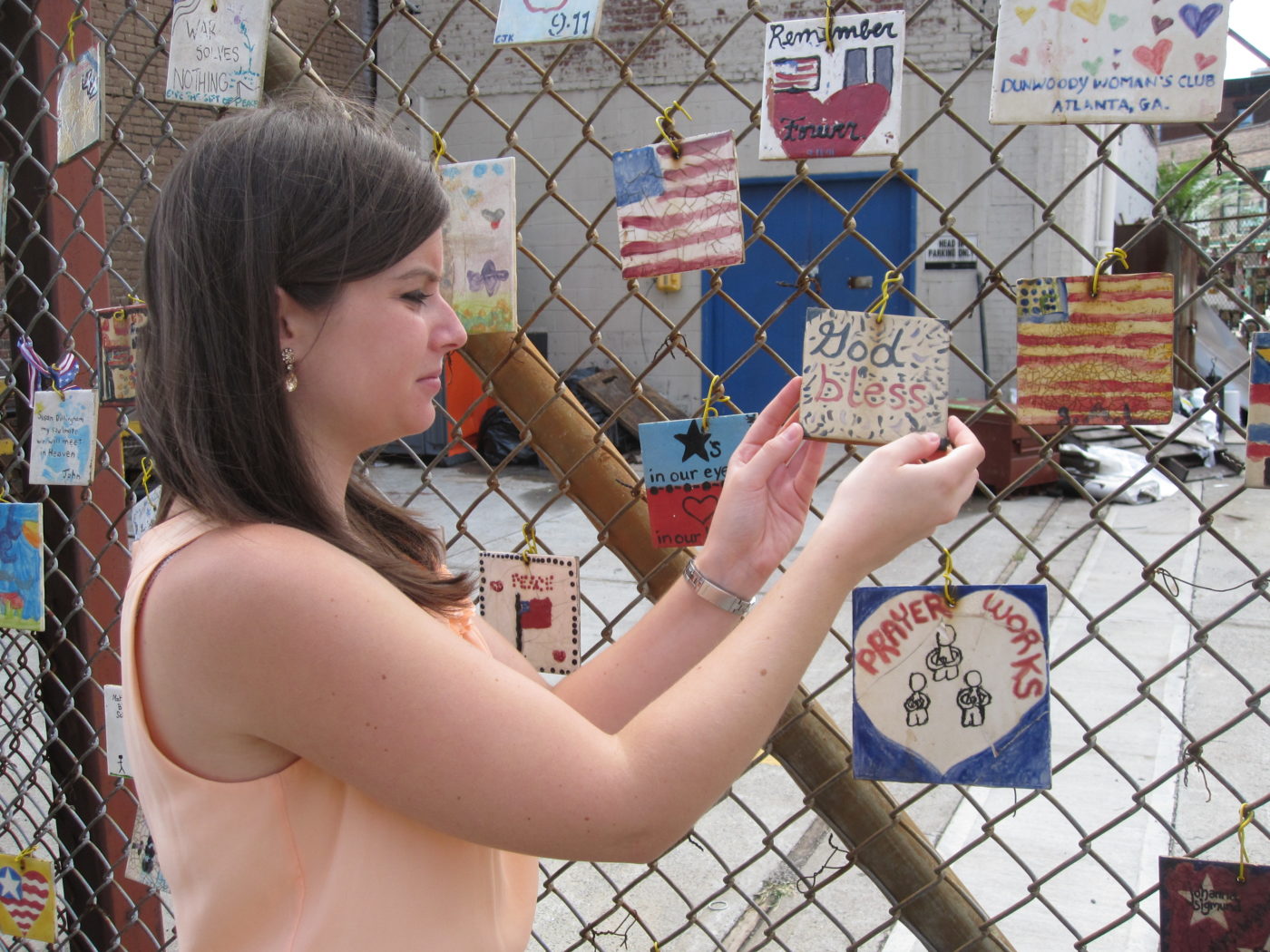 Village Preservation Staff Member Dana Schultz Reinstalling God Bless 9-11Tile 9.8.2011 001.JPG