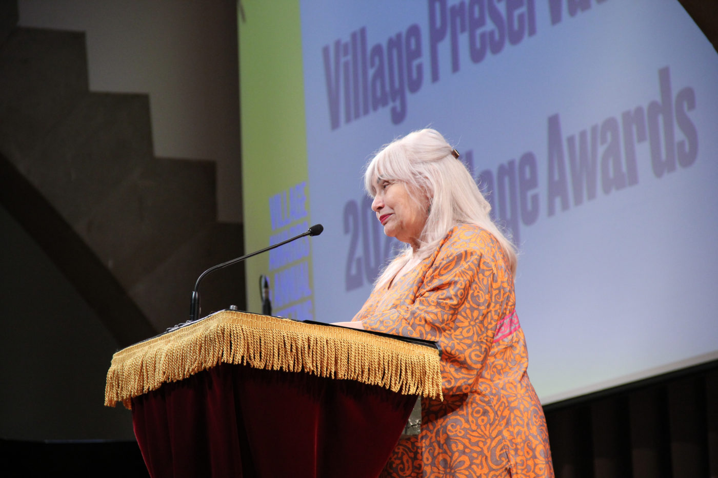 Penny Arcade Emcee'ing the 2022 Village Preservation Annual Village Awards June 2022 at The Cooper Union's Great Hall