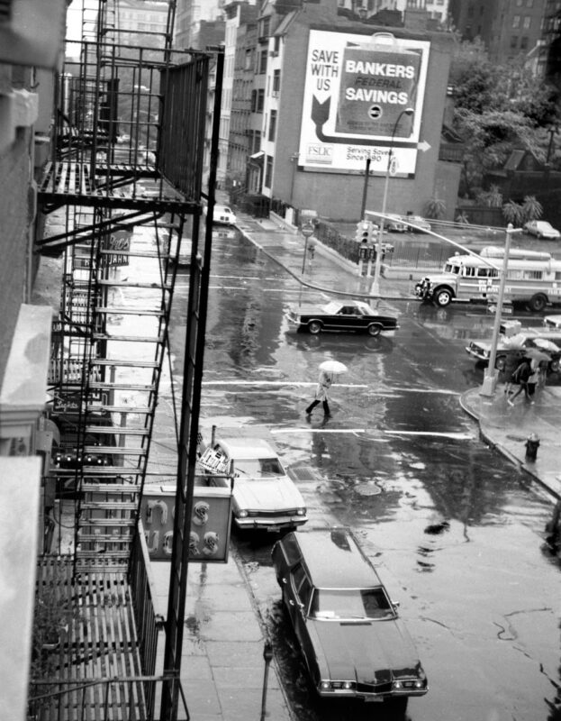 Waverly Place looking west across Sixth Avenue in the rain Village Preservation